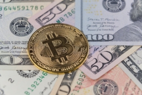 Close-up of a Bitcoin coin on US dollar banknotes, symbolizing cryptocurrency and traditional finance.